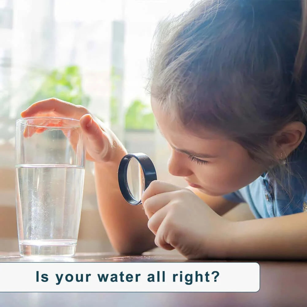 Child is analyzing a glass of water